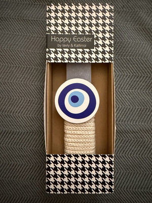 Easter candle new with wooden eye decoration in paper packaging