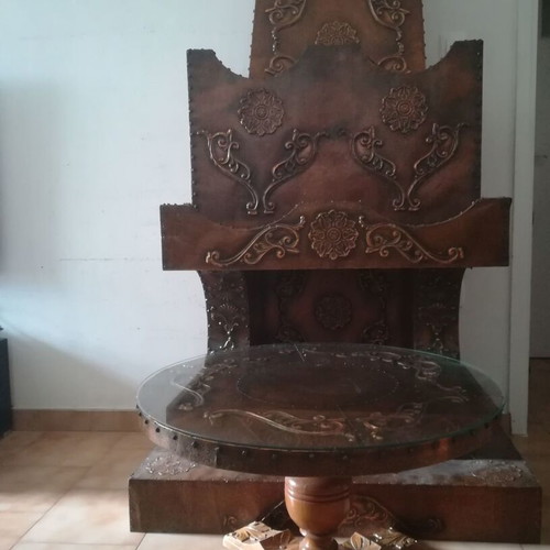 Decorative fireplace set with table and copper wall plaque
