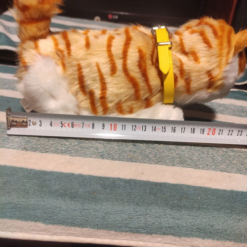 Interactive plush cat with yellow collar, like new