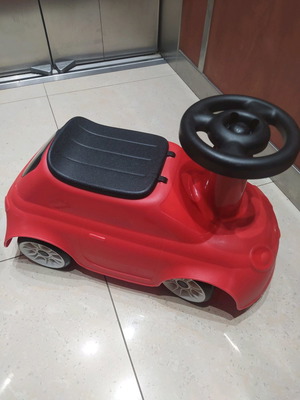 Walker ride-on car used with storage space under the seat