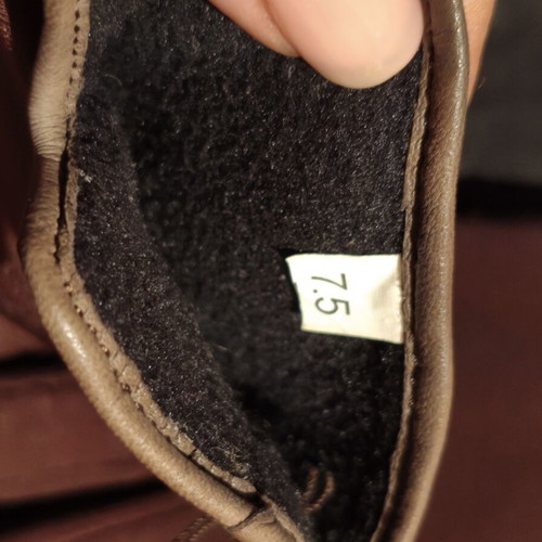 Women's brown gloves used with fleece lining and decorative tassels