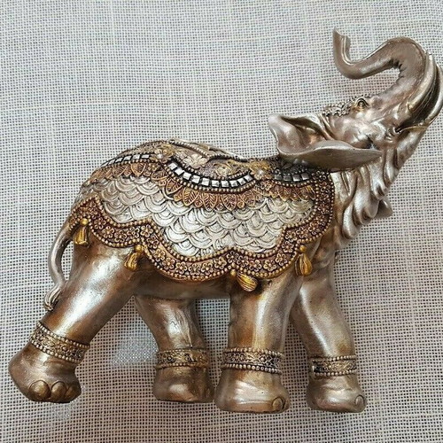 Handmade wooden elephant used with decorations and crystals