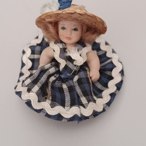 Collectible porcelain doll like new with straw hat and blue checkered dress