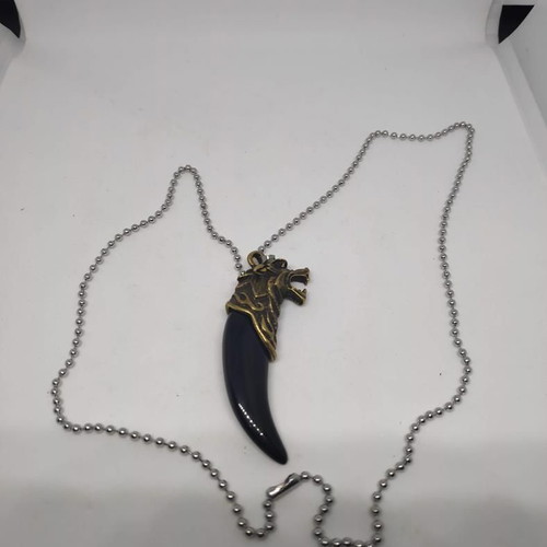 Necklace with wolf tooth pendant like new, gold and black