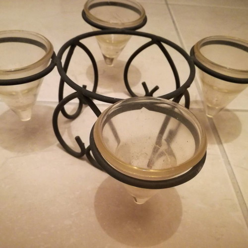 Metal candle holder used for four tealight candles