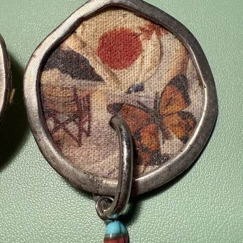 Handmade earrings used with canvas, metal and stones