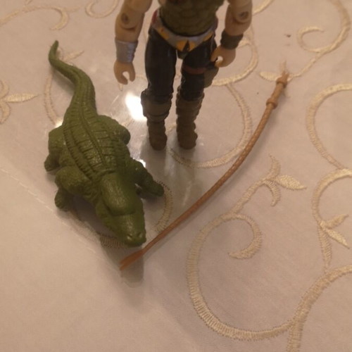 G.I. Joe action figure with alligator, whip and animal muzzle