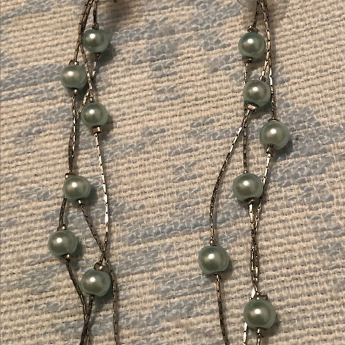 Dangling earrings with sea blue beads used