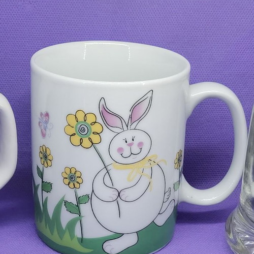 Ceramic mug used with rabbit design for children
