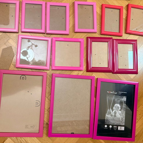 Set of 16 used wall frames in pink and red shades