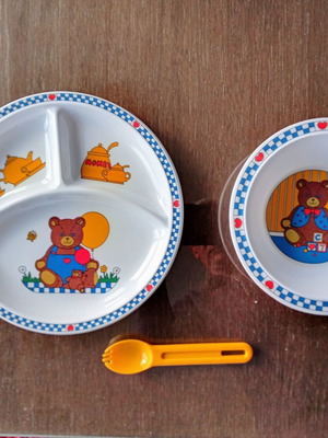Baby feeding set with plate, bowl and spoon used