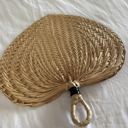 Handmade fans used, natural materials palm leaves and rattan