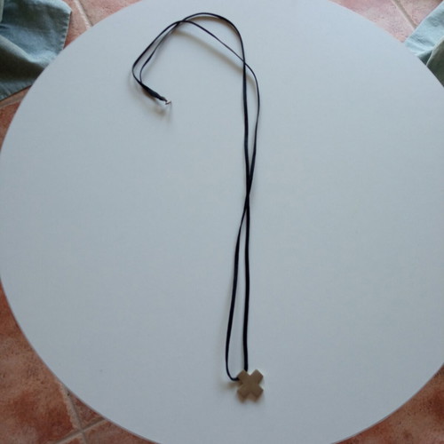 Silver cross with cord like new