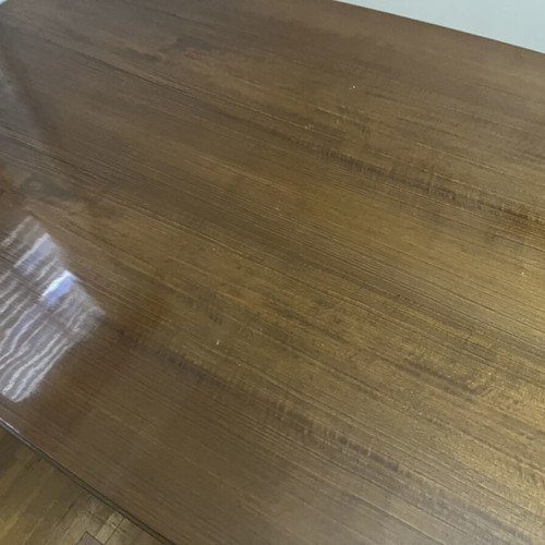 Wooden dining table used with carved legs and metal details