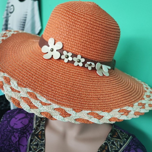 Beach hat like new, orange with flower decoration