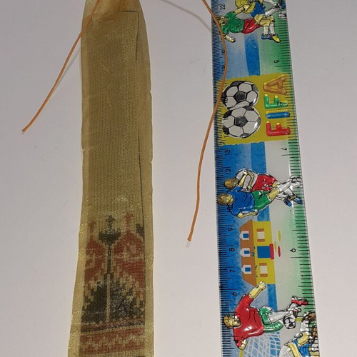 Handmade bookmark with embroidered pattern in black and ecru