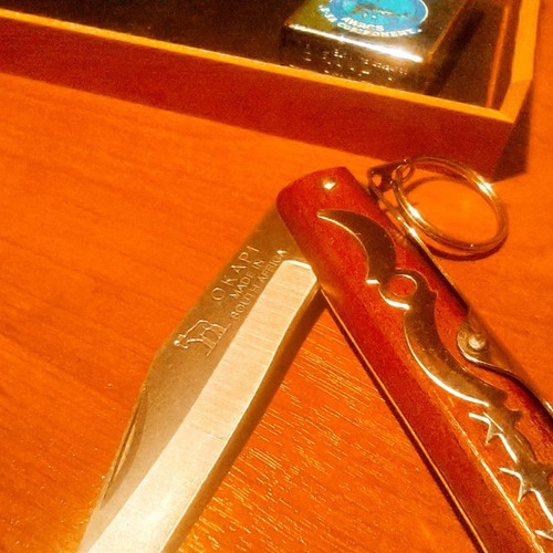 Collectible Zippo lighter 32 years old and handmade Okapi knife.