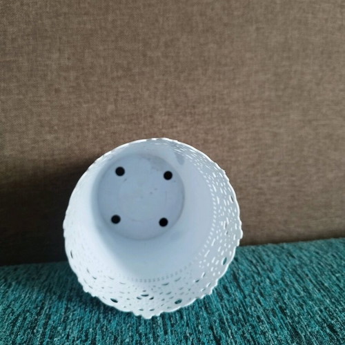 Decorative plastic flowerpot used with minor wear