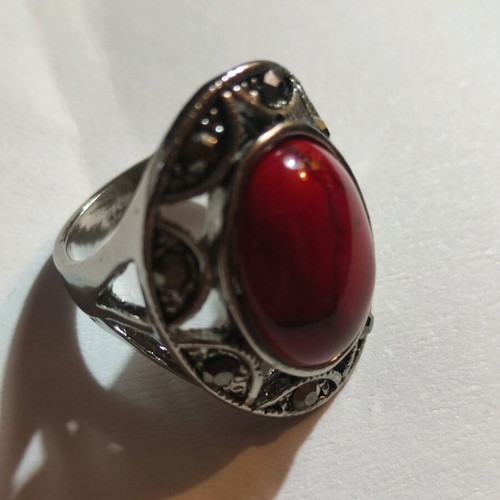 Silver-plated ring with red stone and small crystals new