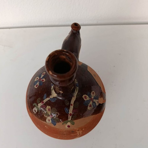 Clay jug with handmade painting used