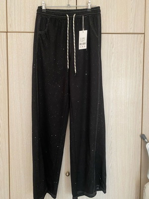 Black jeans-style pants new, size S/M with slight shine