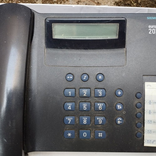 Two phones like new, one landline and one cordless, black and white