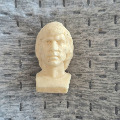 Delikaris football player bust Mr Chips