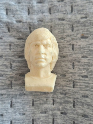Delikaris football player bust Mr Chips