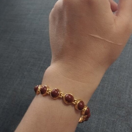 Vintage women's bracelet with red/brown cabochon beads on gold base, like new