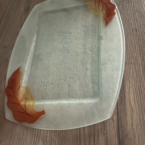 Decorative glass tray used with embossed leaf design