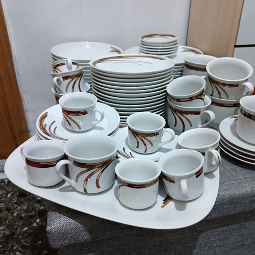 Porcelain set like new, 17 fruit plates, 12 dinner plates, 12 soup plates, 6 tea cups, 6 Greek coffee cups, 6 Nescafe cups, oval platter