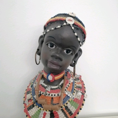 African figurine like new with intricate bead jewelry