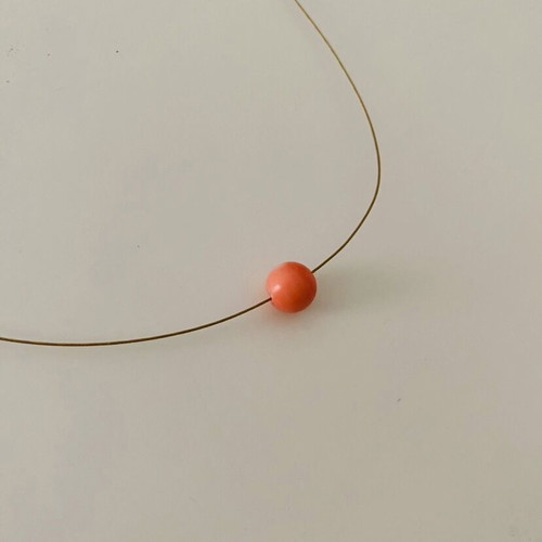 Necklace with orange bead used