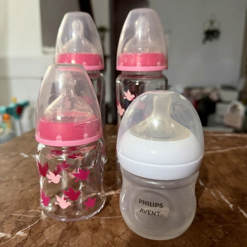 4 baby feeding bottles, 3 glass NUK, 1 plastic Philips