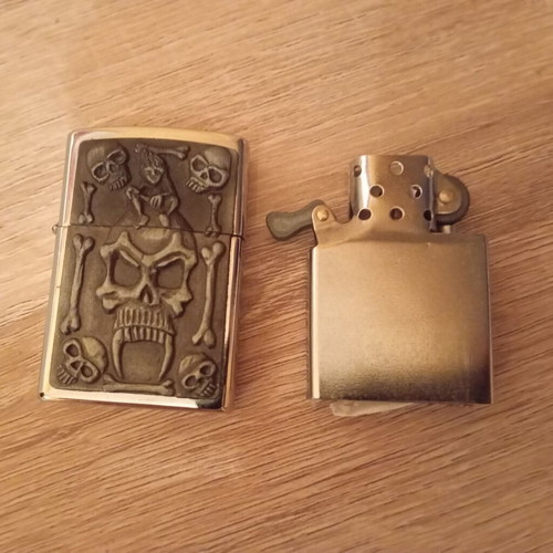 Oil lighter used carved with skull design
