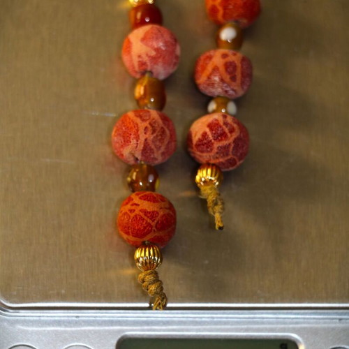 Begleri with genuine coral and 22K gold-plated beads, handmade by Indico Jewells