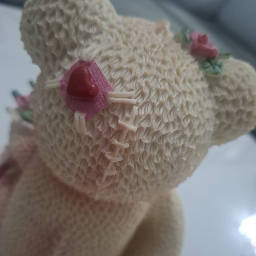 Collectible teddy bear with doll and roses, like new