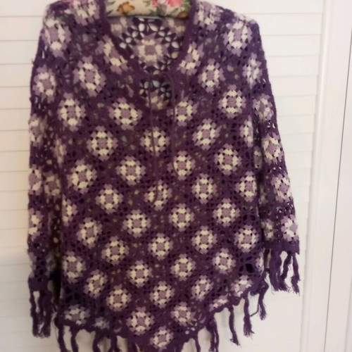 Handmade knitted poncho used in purple shades with fringes