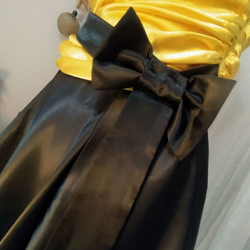 Evening dress like new with black sequins and yellow fabric