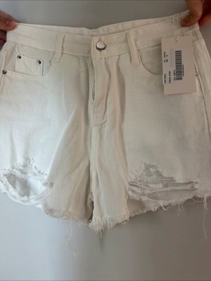 White shorts new with rips size M