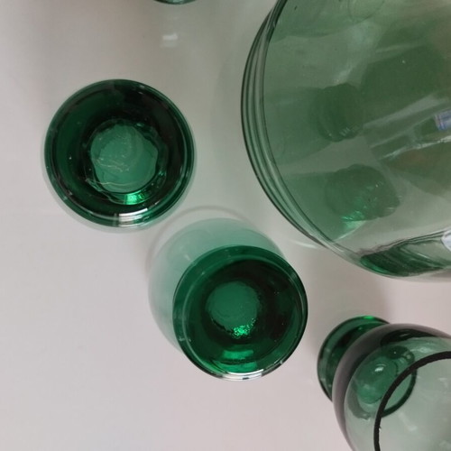 Vintage decanter set with 5 green glass shot glasses used