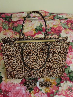 Leopard print women's handbag with strap