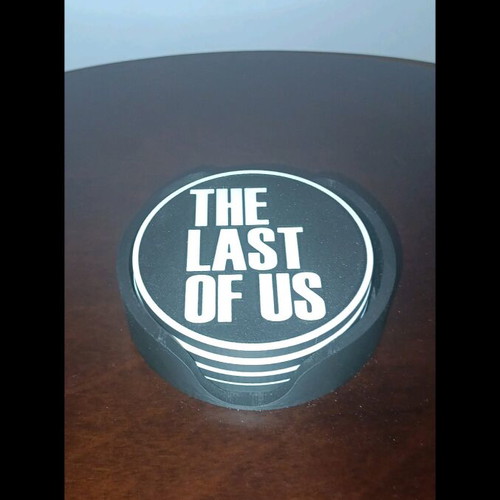 Last of Us coasters like new, set of 4 with base