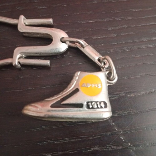 Vintage metal Aris sneaker keychain used