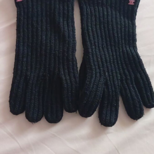 Black rib-knit gloves used with embroidered Gemini symbol