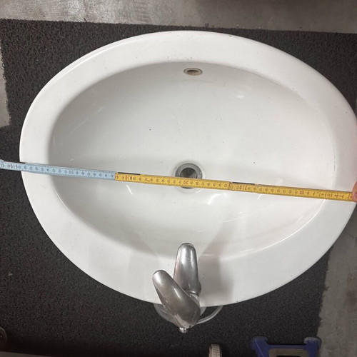 Bathroom sink used with faucet