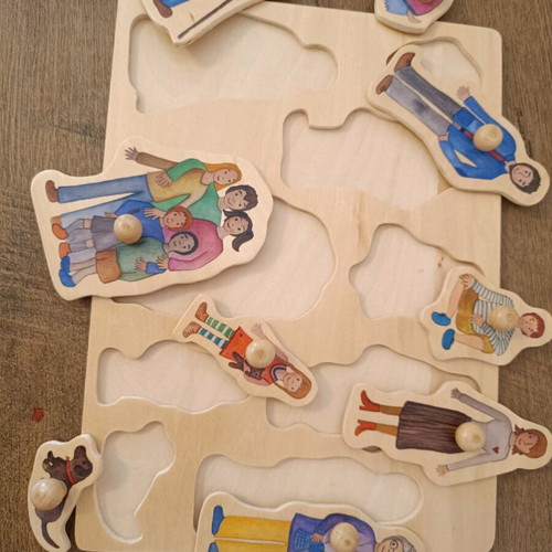 Wooden family puzzle with pegs like new