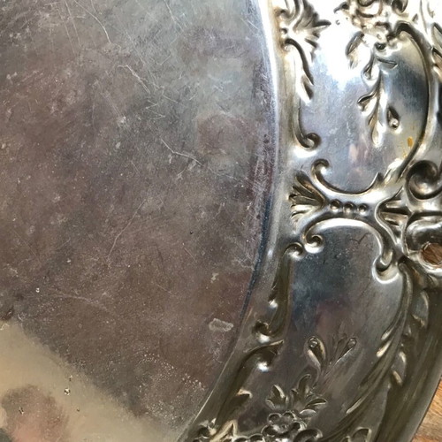Silver-plated round disc used with age damage