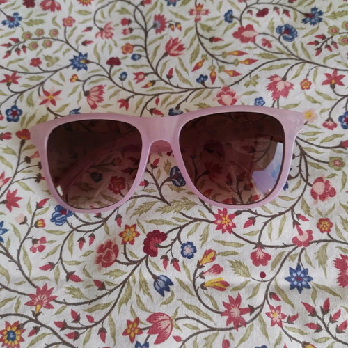 Purple sunglasses used with case