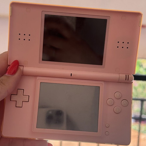 Nintendo DS used with 5 game cartridges and charger